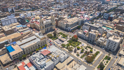 Chiclayo’s Main Square featuring the iconic Cathedral, central fountain, green gardens, and a...