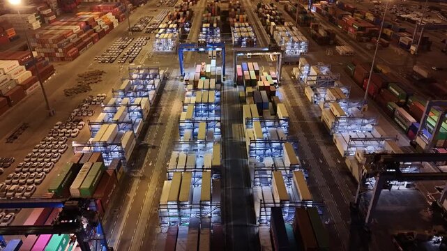 Aerial drone view of Ashdod Port in Israel with shipping containers, cargo ships and vehicle storage yards along the harbor. Industrial seaport showing global trade, import and export logistics, trans