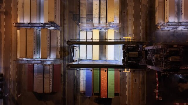 Aerial drone view of Ashdod Port in Israel with shipping containers, cargo ships and vehicle storage yards along the harbor. Industrial seaport showing global trade, import and export logistics, trans