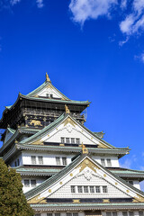 Naklejka premium Close up detail of Osaka castle with autumn blue sky white cloud, frame one of japan's best destination for travel, Osaka Japan.