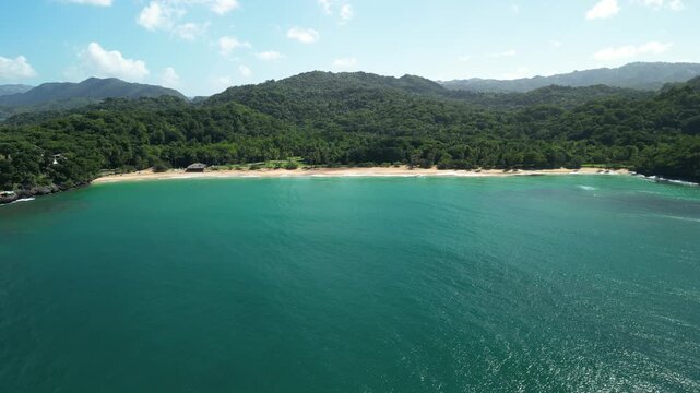Final panoramic drone view linking Limon Island with Moron Beach and surrounding coastal scenery.