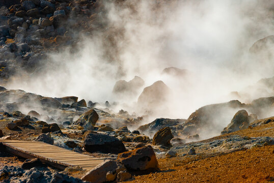 Kr&yacute;suv&iacute;k is a vibrant geothermal area on Iceland's Reykjanes Peninsula, famous for its colorful, mineral-stained hills, bubbling mud pots, steaming fumaroles (steam vents), and hot springs.