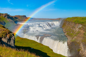 gullfoss, is iceland's famous "golden falls, " a powerful, two-tiered waterfall on the hvítá river, forming a key part of the popular golden circle tour in south iceland © PálmiG