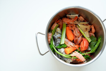 Making homemade Seafood Stock against a white background, Copy space 