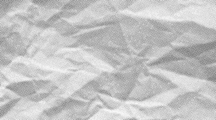 Fototapete Pop Art Halftone crumpled paper texture with black a dotted, rough, and wrinkled surface. Wite creased sheet background in comic pop-art style, featuring grainy folds and gritty distressed details.  © Maryna