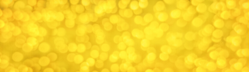 Golden Christmas bokeh lights background for festive banners and holiday design