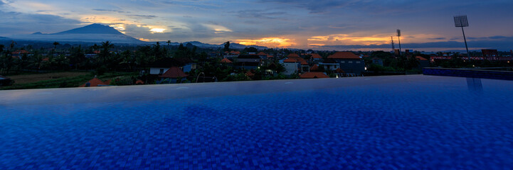 Beautiful blue pool with a mountain in the background