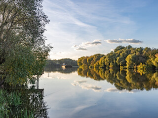 Calm lake with a boat in the water