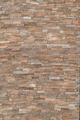 Natural stone wall texture with stacked rectangular slabs