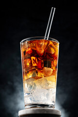 Cold whiskey cocktail with ice cubes in a tall glass, Refreshing alcoholic drink concept for bar