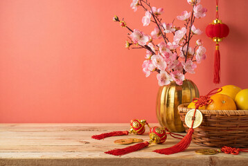 Chinese New Year decorations on wooden table over red background