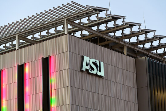 The ASU Sidney Poitier New American Film School logo mounted on a modern academic building exterior, illustrating higher education branding, arts education, and university campus architecture