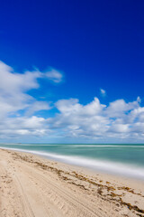 Just a nice photo of the beach. Long exposure to smoothen the water and clouds in sky
