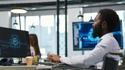 IT professional in wheelchair in inclusive office developing software applications using AI...