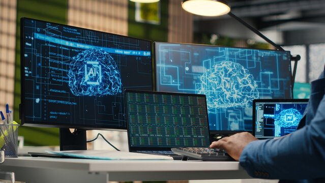 Black businessman using AI digital tools and machine learning models, performing data analysis for innovation creating adaptive optimized business solutions. Cloud computing. Camera B. - Powered by Adobe