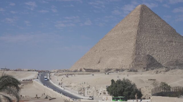 Cairo,Egypt - December 5, 2025: Tourists Walking on Giza pyramid complex