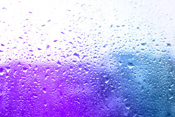 Glass window surface with water drops, closeup view