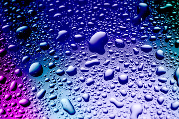 Glass surface with water drops, closeup view