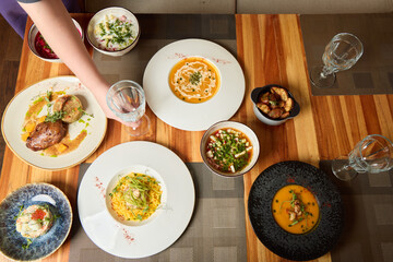 Enjoying Delicious Gourmet Dishes Beautifully Served on a Chic and Stylish Table Decor