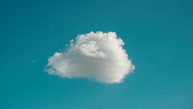 A single cloud in the blue sky. 