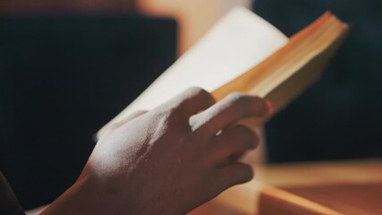 participant fully engrossed in literature, individual intently absorbing information from printed pages, reader entirely absorbed in novel while librarian appreciates quiet atmosphere