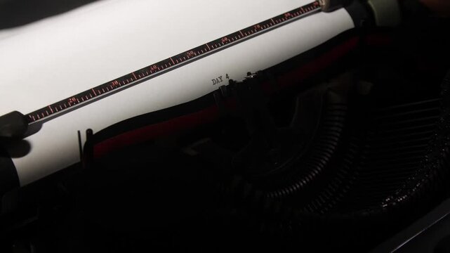 Vintage typewriter imprinting day 4 on white paper, close up of retro keys and platen conveying daily routine, writing progress, scheduling and nostalgic creativity