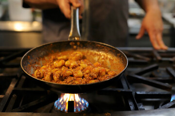 chef preparing gnocchi by hand in the traditional way