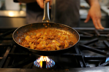 chef preparing gnocchi by hand in the traditional way