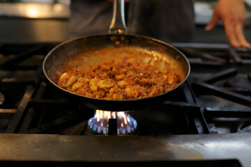 chef preparing gnocchi by hand in the traditional way