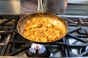 chef preparing gnocchi by hand in the traditional way