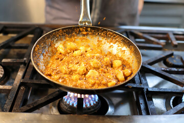 chef preparing gnocchi by hand in the traditional way