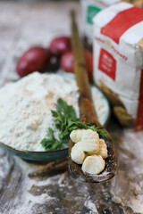 chef preparing gnocchi by hand in the traditional way