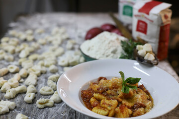 chef preparing gnocchi by hand in the traditional way