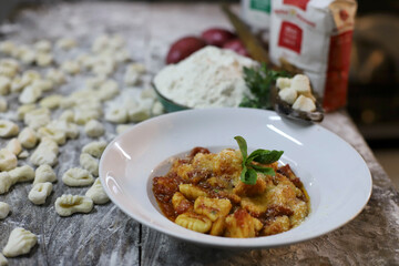 chef preparing gnocchi by hand in the traditional way