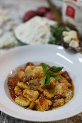 chef preparing gnocchi by hand in the traditional way