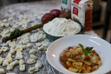 chef preparing gnocchi by hand in the traditional way