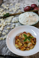 chef preparing gnocchi by hand in the traditional way