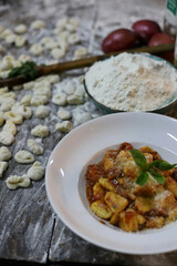 chef preparing gnocchi by hand in the traditional way