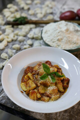 chef preparing gnocchi by hand in the traditional way