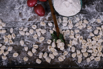 chef preparing gnocchi by hand in the traditional way