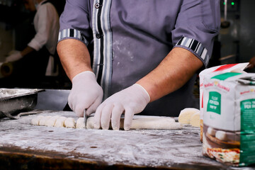 chef preparing gnocchi by hand in the traditional way