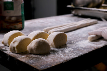 chef preparing gnocchi by hand in the traditional way