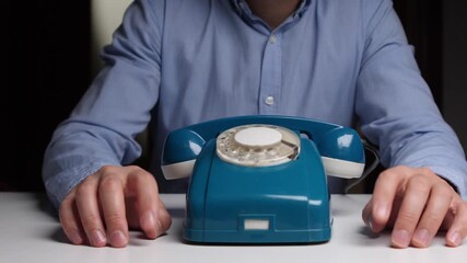 Man hesitates dialing, Closeup of person contemplating dial decision, Man cautiously decides to press phone number keys, Close shot man hesitating before dialing his intended telephone number - Powered by Adobe