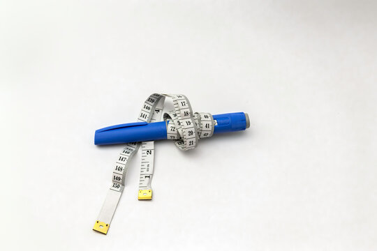 Semaglutide  Injection Pen like Ozempic with Measuring Tape on White Background, copy space, isolated