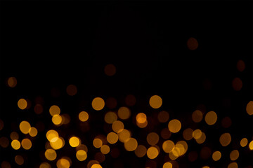 Golden bokeh light overlay isolated on black
