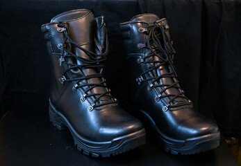 Black leather military-style combat boots. Tactical black leather combat boots.