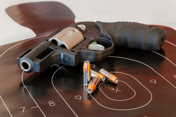 Ready Aim: Handgun and Ammunition in a Controlled Shooting Range Scene