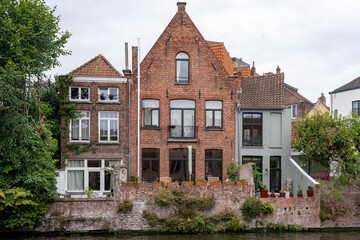 Scenic view of traditional brick canal houses with garden terraces in Bruges, Belgium