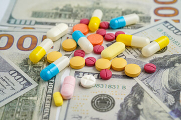 Pills on money dollars, Medicine prescription drugs cost concept, healthcare expenses