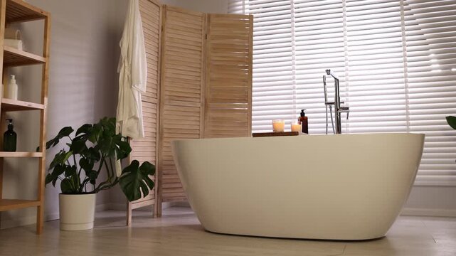 Stylish bathroom interior with folding screen and tub. Camera moving forward